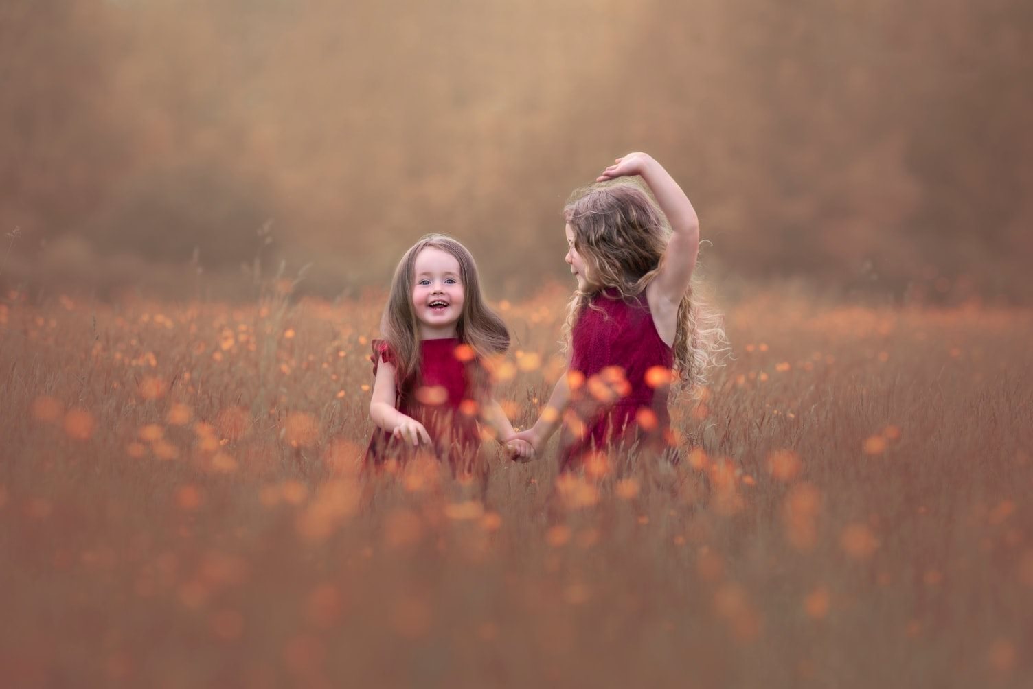 children playing in a fall field